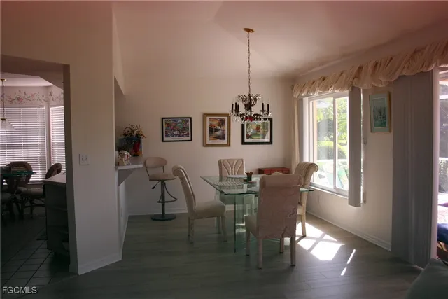 a view of a livingroom with furniture window and wooden floor