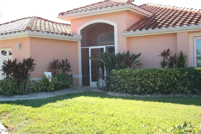 a front view of a house with garden