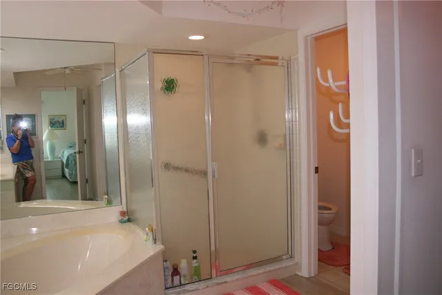 a bathroom with a shower and a tub