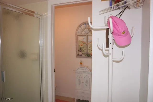 a bathroom with a mirror and a shower