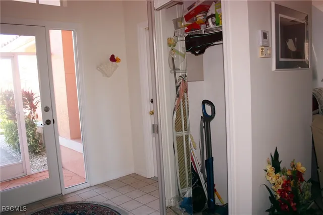 a view of a hallway with wooden floor and stairs