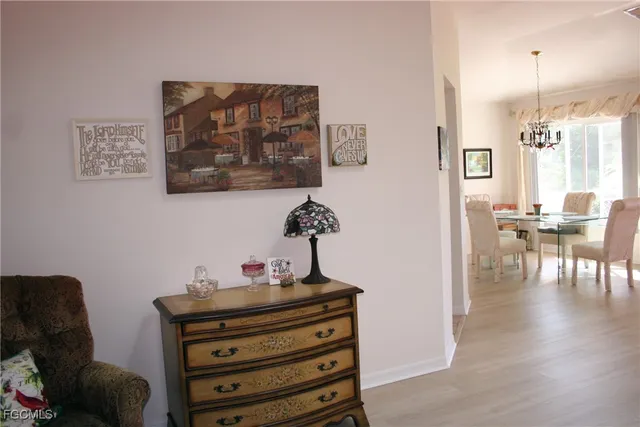 a view of a workspace with furniture and wooden floor