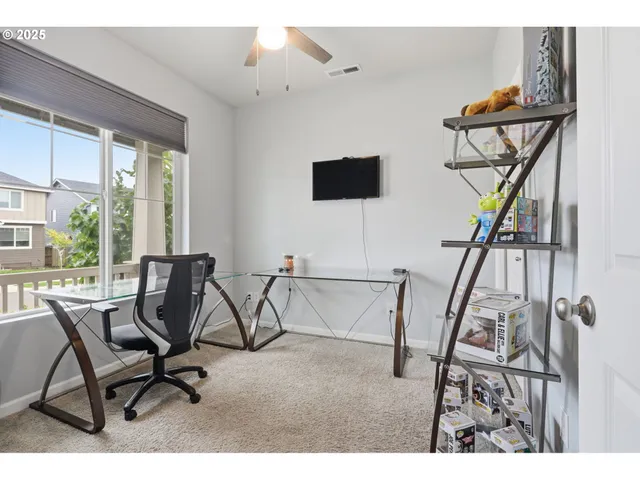 a view of a livingroom with furniture and a window