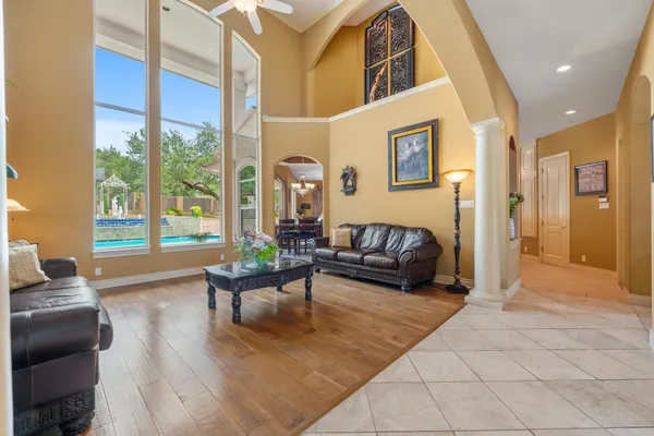 a living room with furniture and a large window