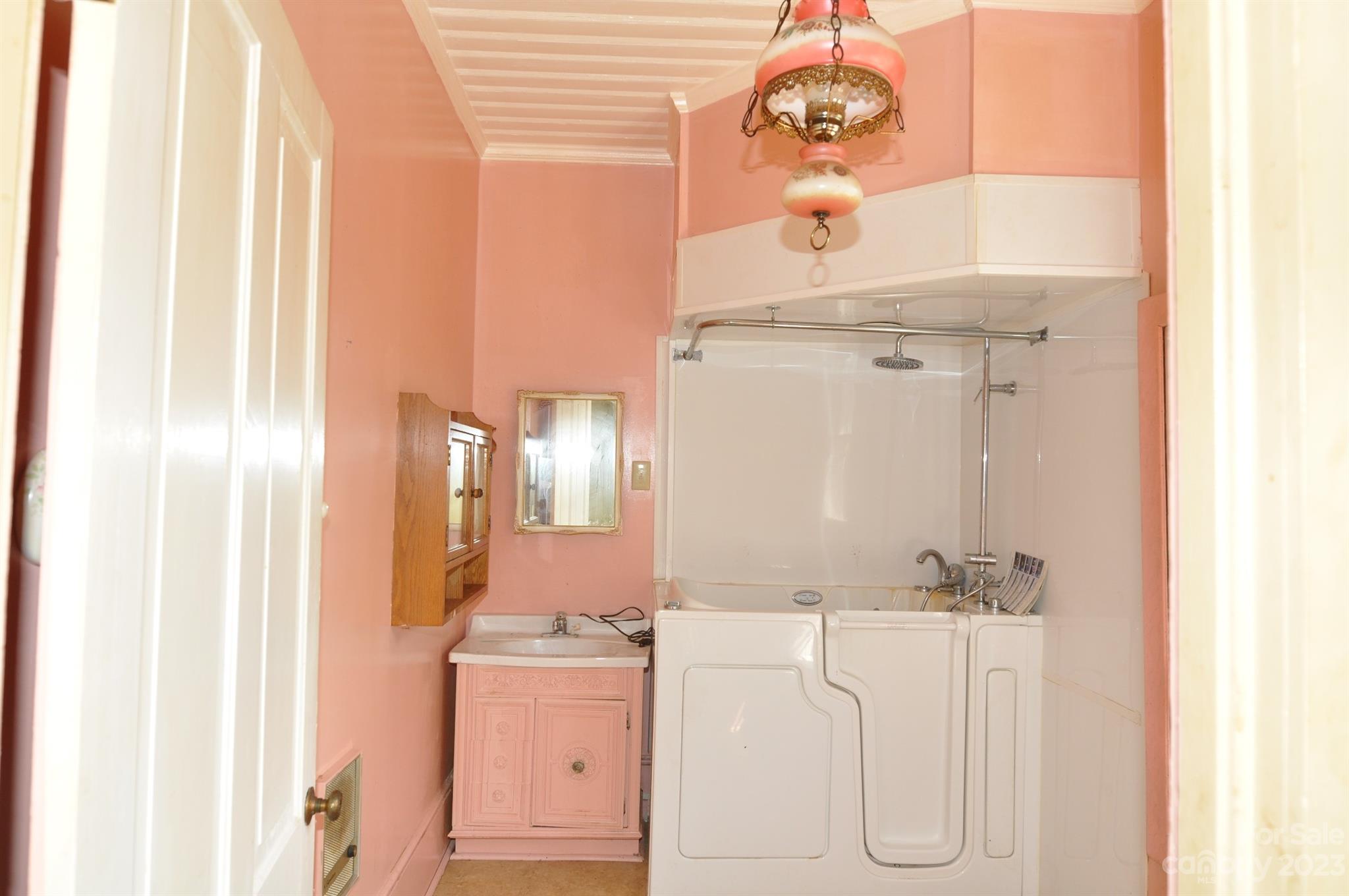 160 York Street Chester, SC 29706 - Photo 13 of 34 a bathroom with a sink vanity and a mirror