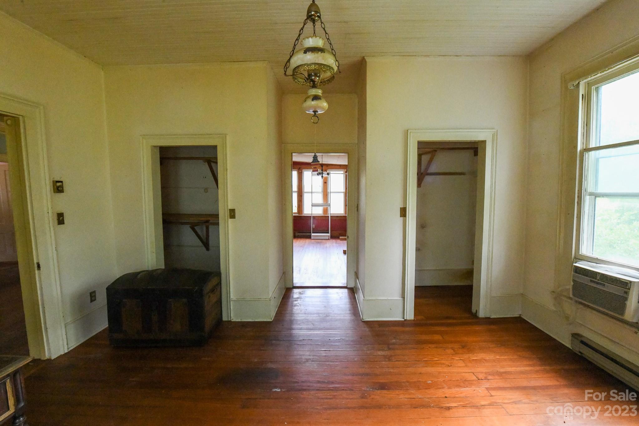 160 York Street Chester, SC 29706 - Photo 18 of 34 a hallway with a door and wooden floor