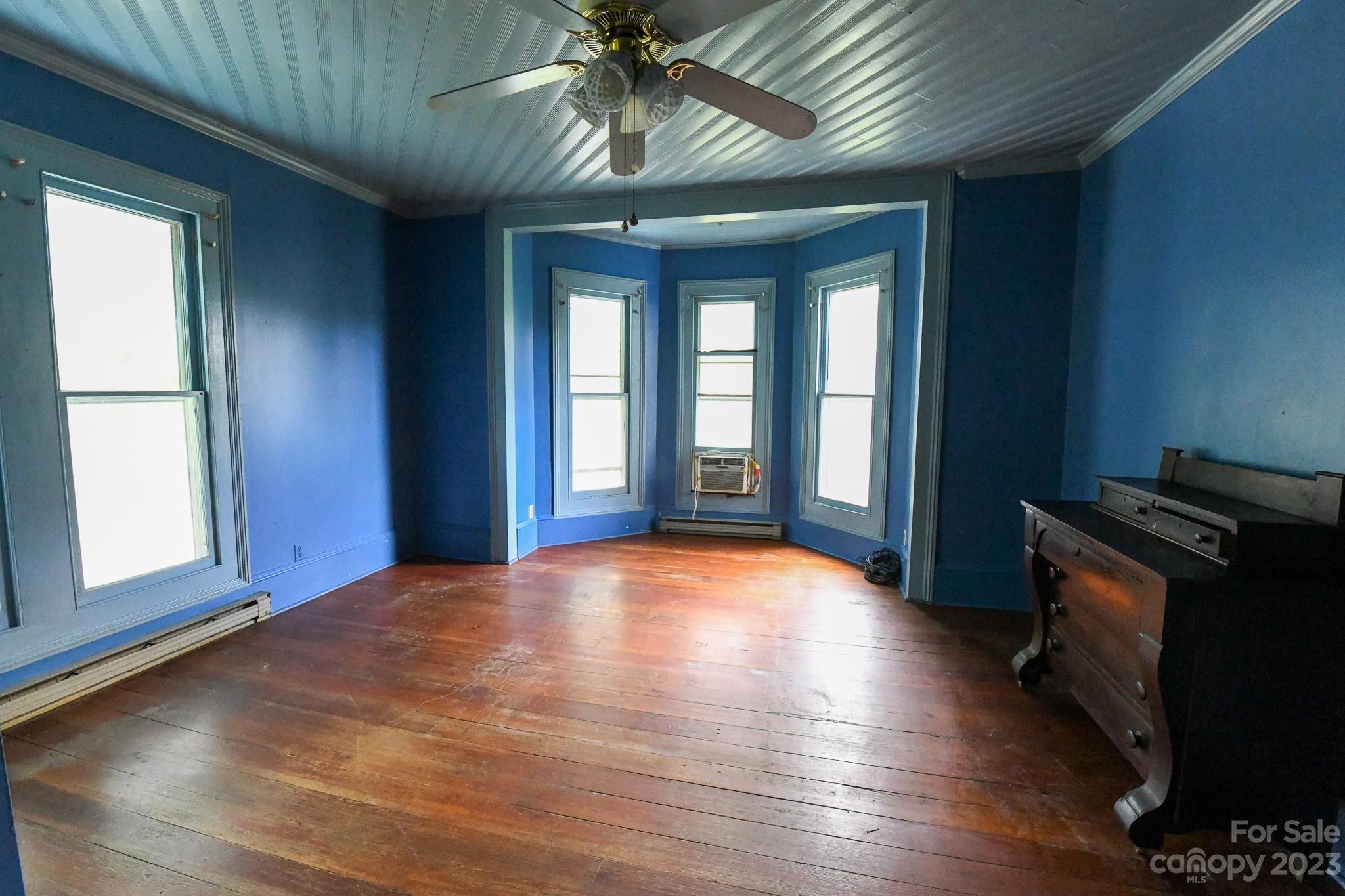 160 York Street Chester, SC 29706 - Photo 20 of 34 a view of an empty room with a window and wooden floor