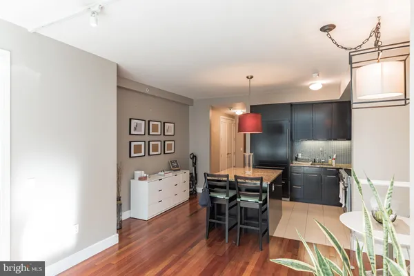 a kitchen with a table and chairs
