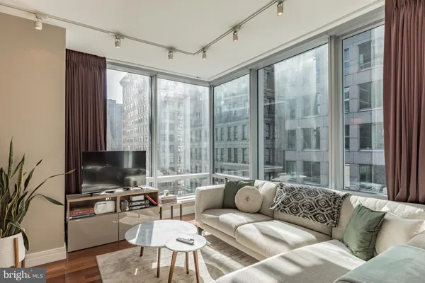 a living room with furniture and a large window