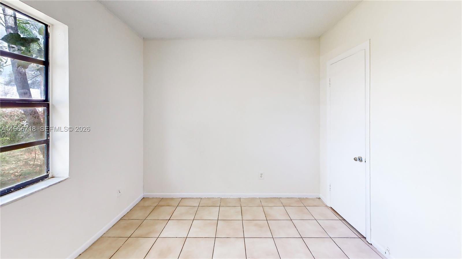 1664 Southwest 2 Court Homestead, FL 33030 - Photo 21 of 57 a view of an empty room and window