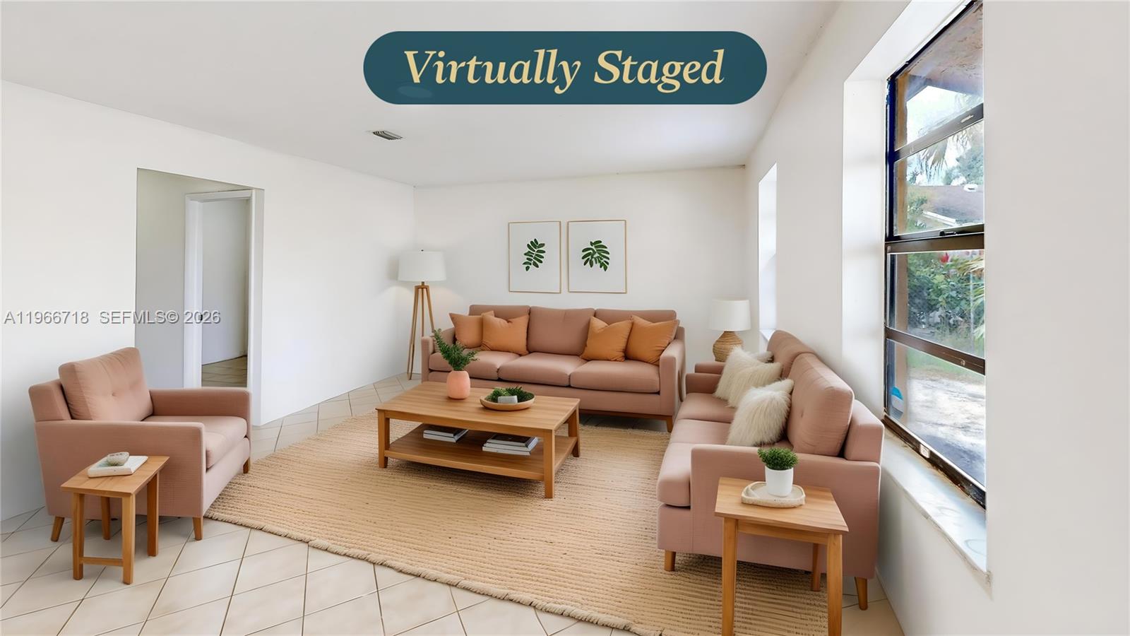 1664 Southwest 2 Court Homestead, FL 33030 - Photo 3 of 57 a living room with furniture and a large window