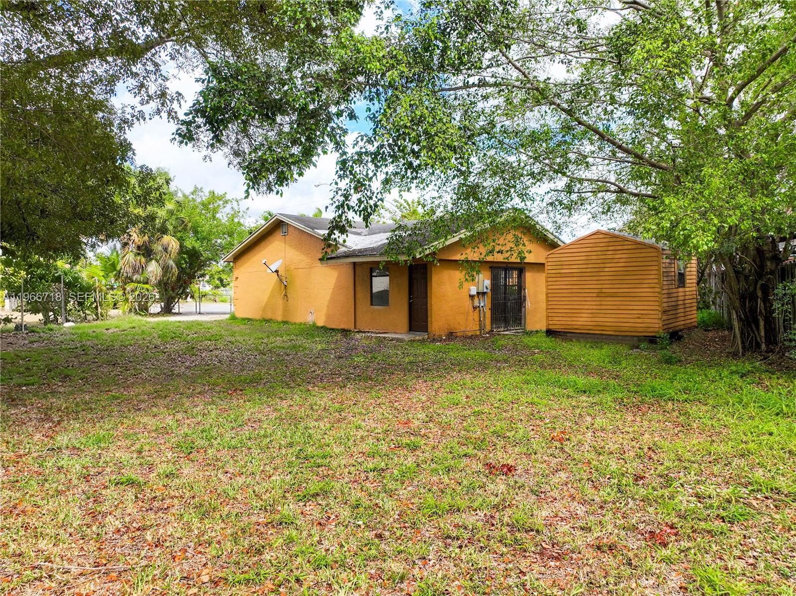 1664 Southwest 2 Court Homestead, FL 33030 - Photo 36 of 57 a house view with garden space