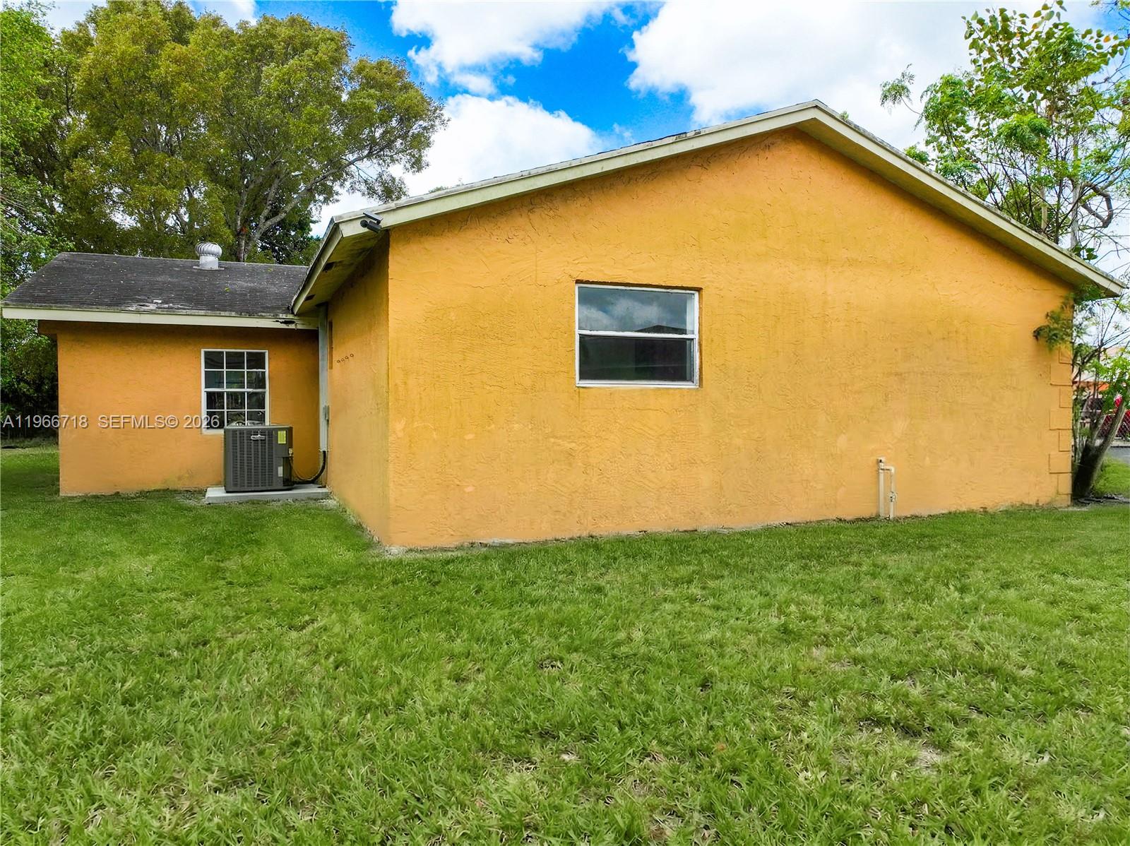 1664 Southwest 2 Court Homestead, FL 33030 - Photo 38 of 57 front view of a house with a backyard
