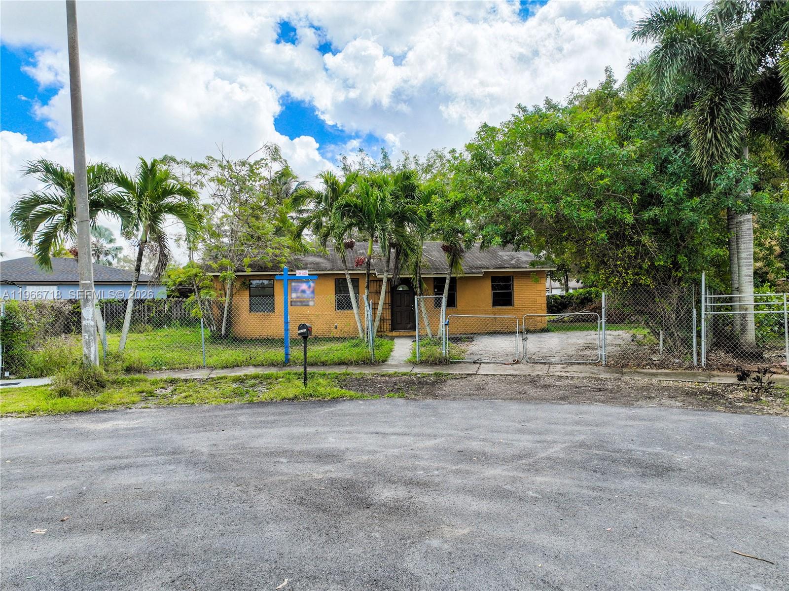 1664 Southwest 2 Court Homestead, FL 33030 - Photo 40 of 57 a front view of house with yard and green space