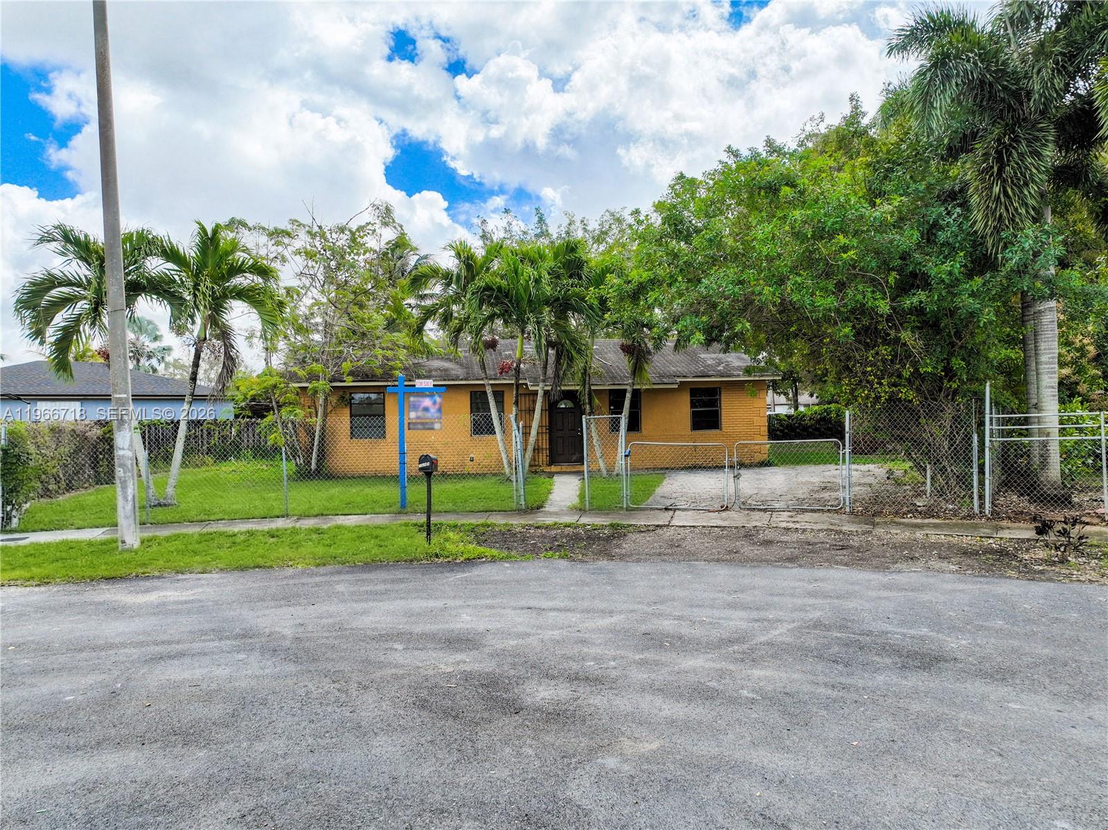 1664 Southwest 2 Court Homestead, FL 33030 - Photo 57 of 57 a view of a house with a yard and large trees
