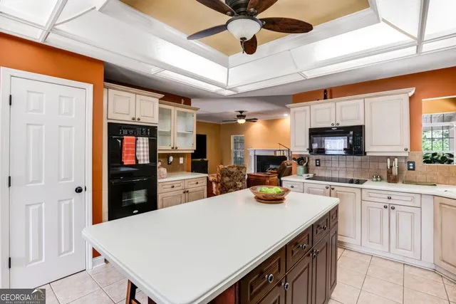 a kitchen with a refrigerator a stove a sink dishwasher and wooden cabinets