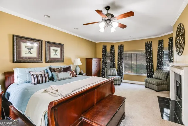 a bed room with a bed and a large window