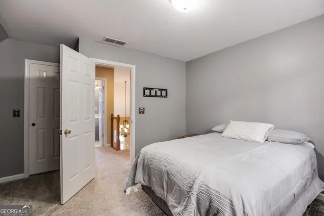 a bedroom with a bed and a table