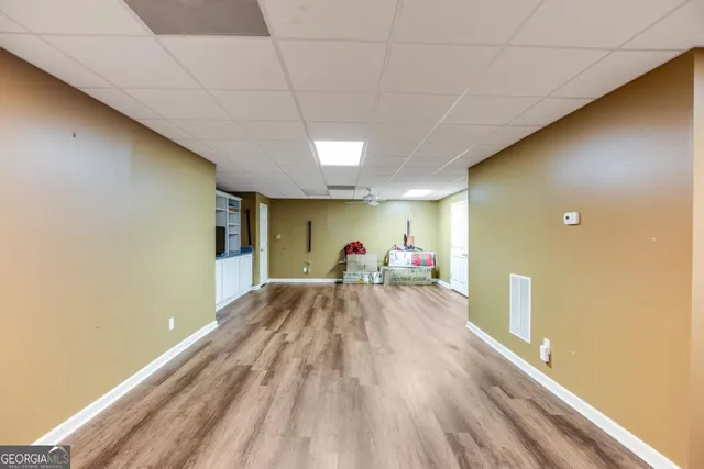 a view of a big room with wooden floor