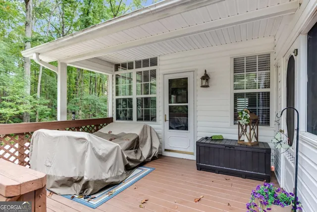 a bed sitting in a bedroom next to a large window