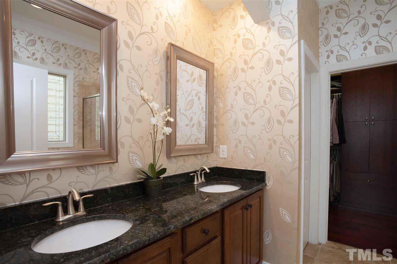 1410 Van Page Boulevard Raleigh, NC 27607 - Photo 14 of 25 a bathroom with a granite countertop sink and a mirror