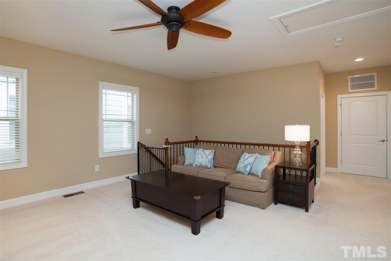 1410 Van Page Boulevard Raleigh, NC 27607 - Photo 17 of 25 a living room with furniture and a window