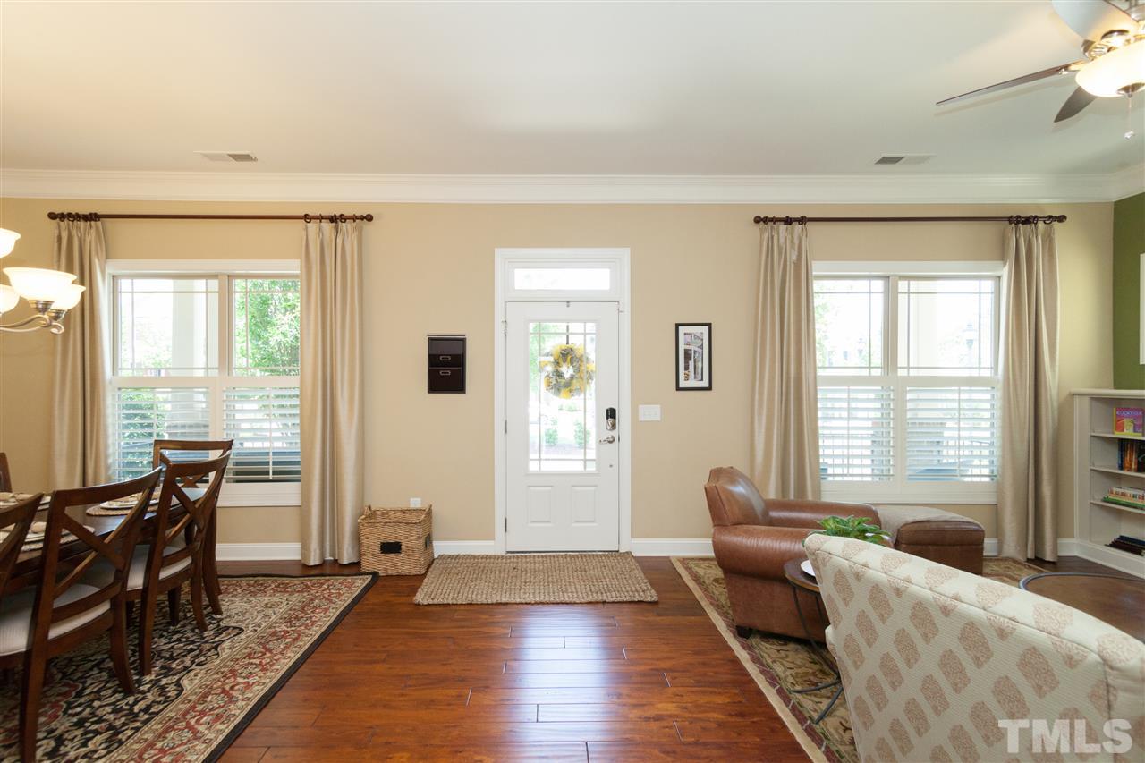 1410 Van Page Boulevard Raleigh, NC 27607 - Photo 3 of 25 a living room with furniture and large windows