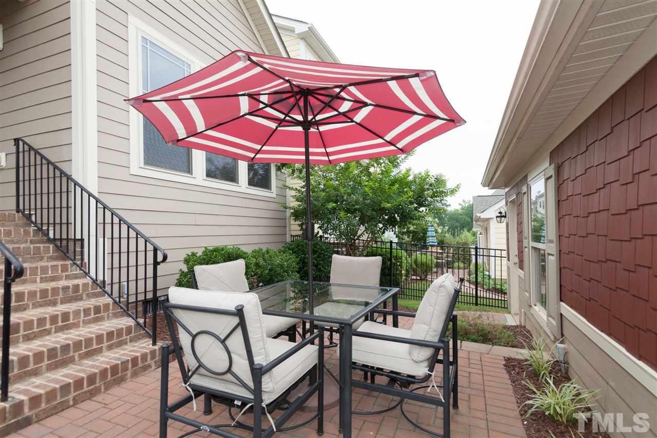 1410 Van Page Boulevard Raleigh, NC 27607 - Photo 22 of 25 a view of a chair and table in the balcony