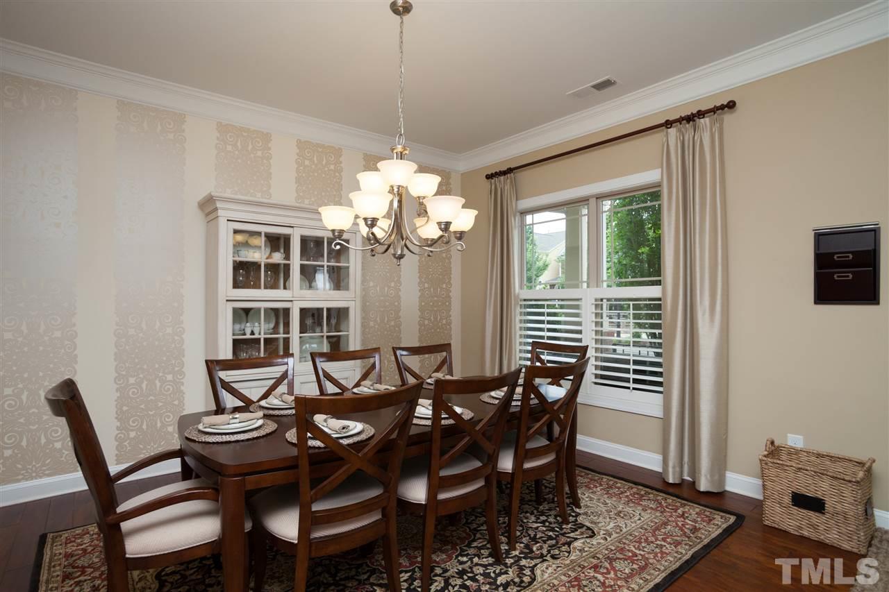 1410 Van Page Boulevard Raleigh, NC 27607 - Photo 6 of 25 a view of a dining room with furniture window and wooden floor