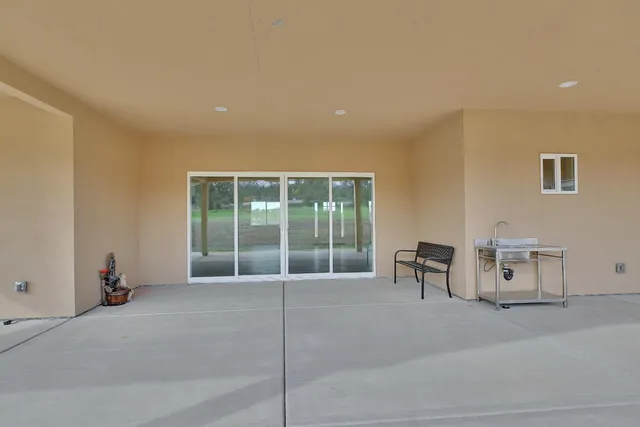 an empty room with a empty space and windows