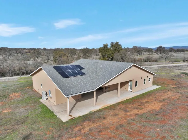 a backyard of a house with lots of green space