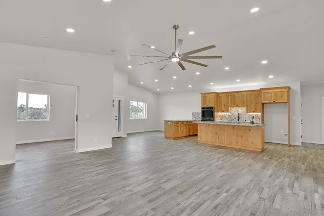 a view of kitchen with cabinet and wooden floor