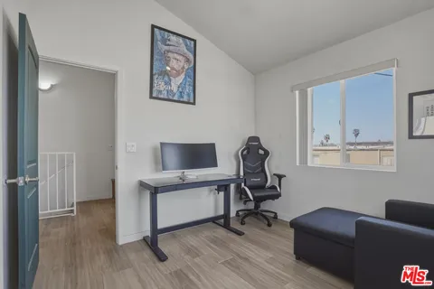 a workspace with furniture and mirror