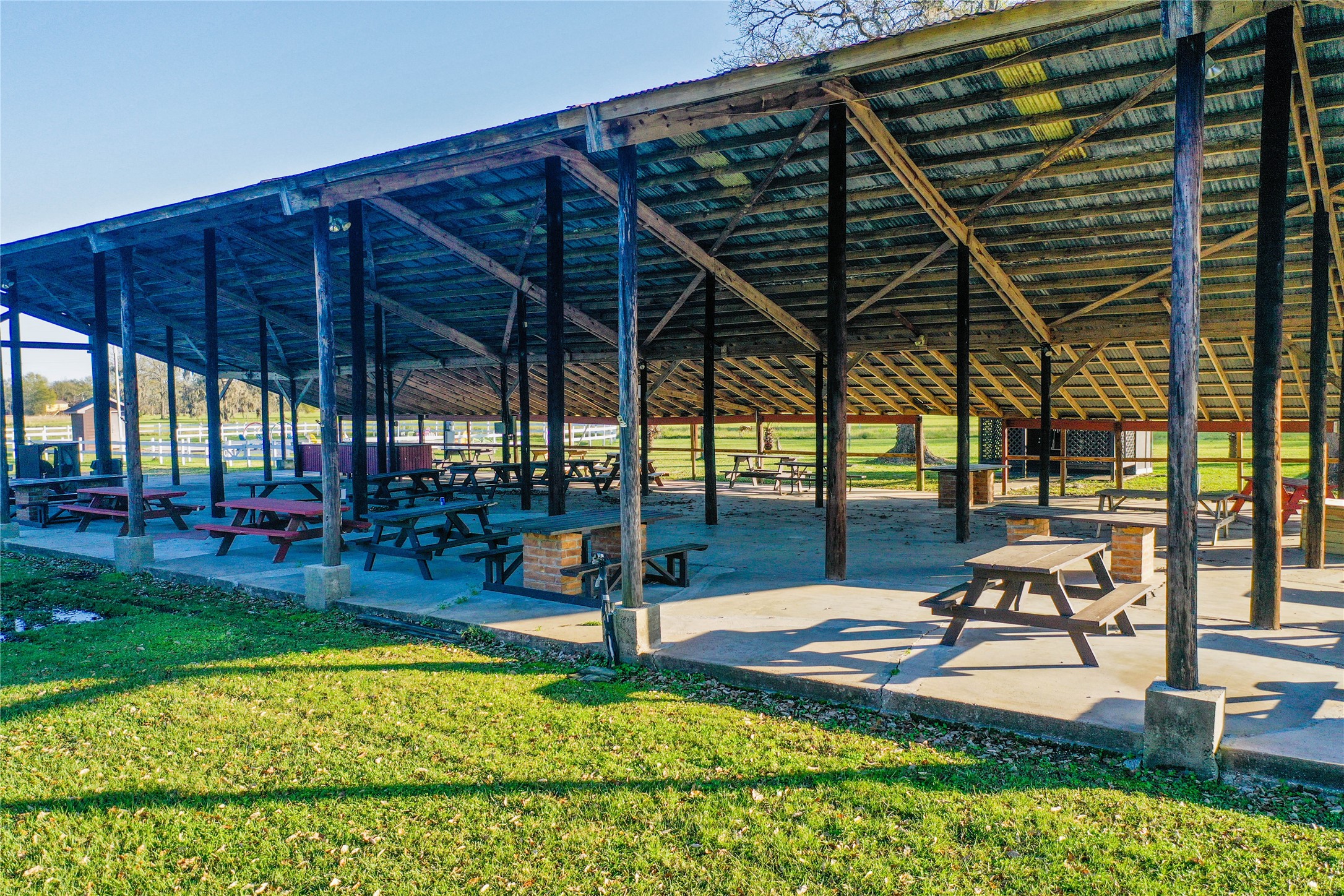 212 Carpenter Drive Cleveland, TX 77327 - Photo 20 of 23 a view of a backyard with sitting area