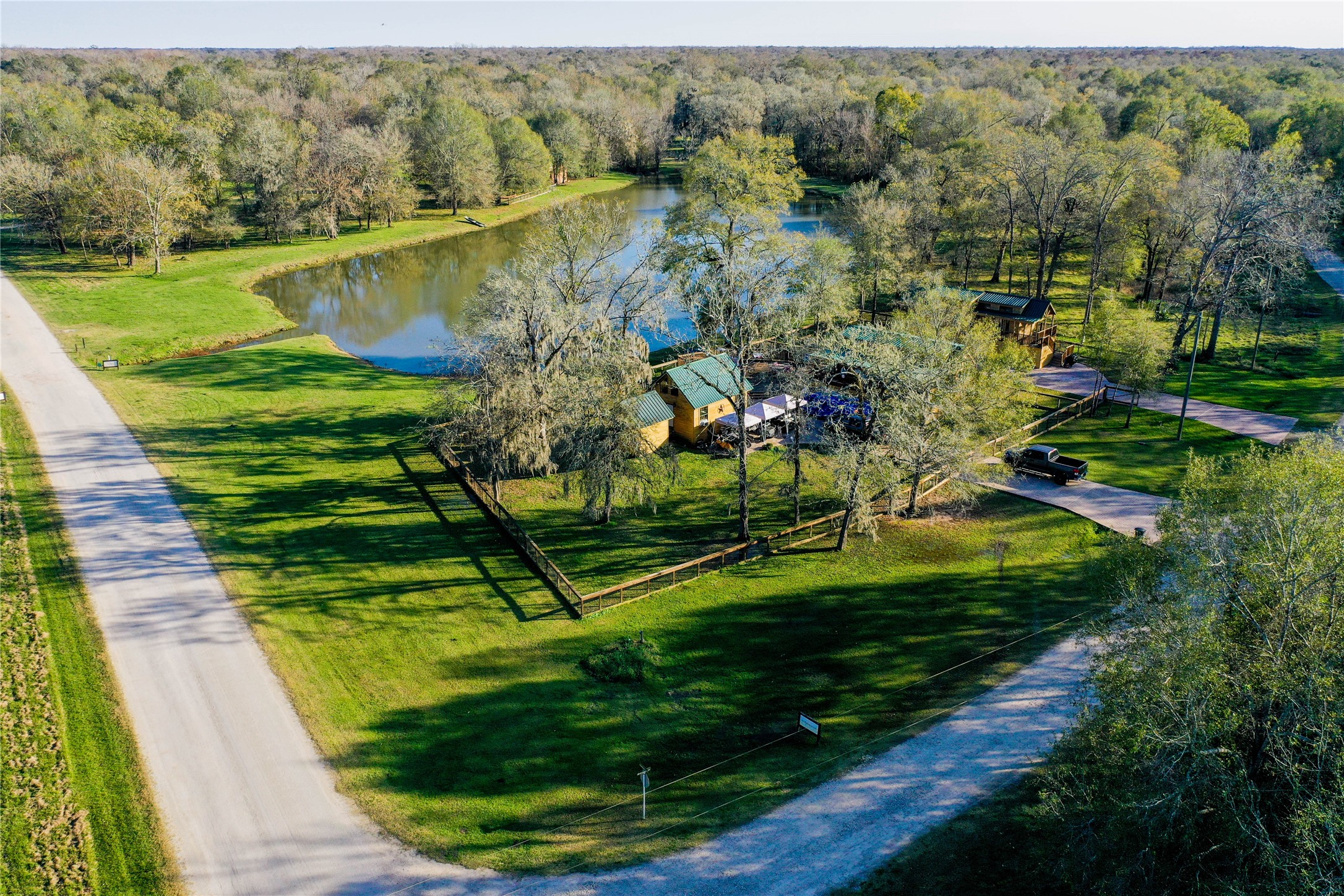 212 Carpenter Drive Cleveland, TX 77327 - Photo 7 of 23 a view of a lake with a park
