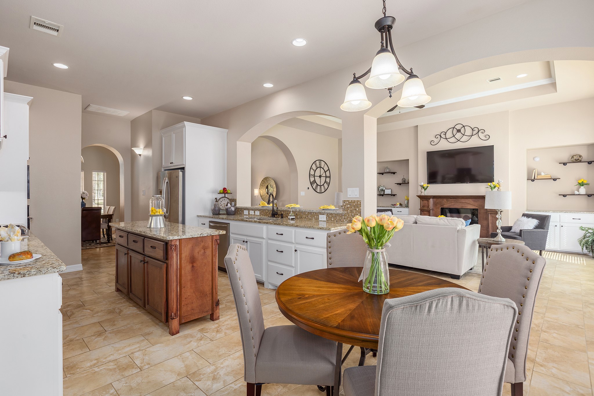 27688 Rio Blanco Drive Splendora, TX 77372 - Photo 16 of 50 a large kitchen with sink a dining table and chairs