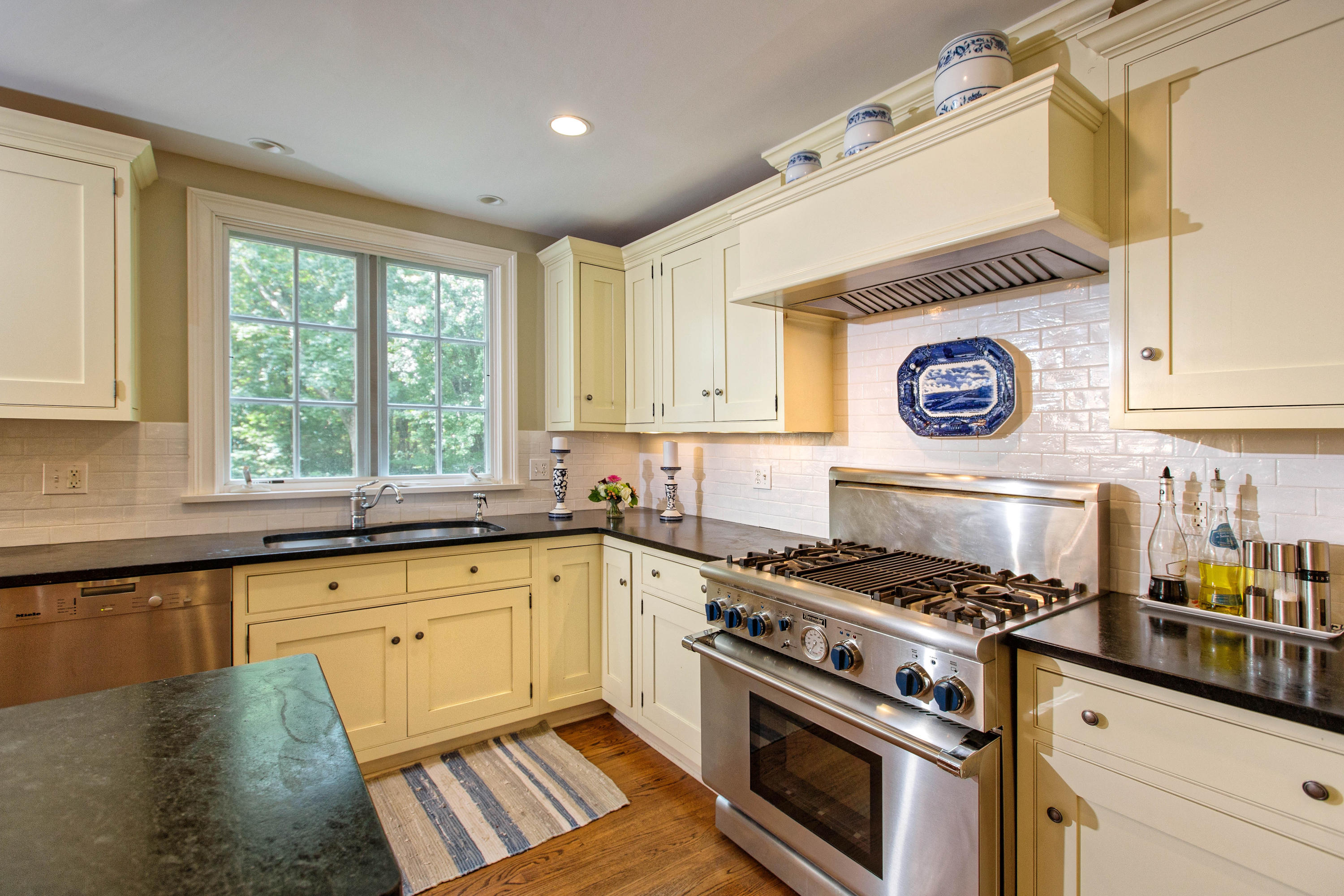 292 Briscoe Road New Canaan, CT 06840 - Photo 13 of 45 a kitchen with granite countertop a stove and a sink