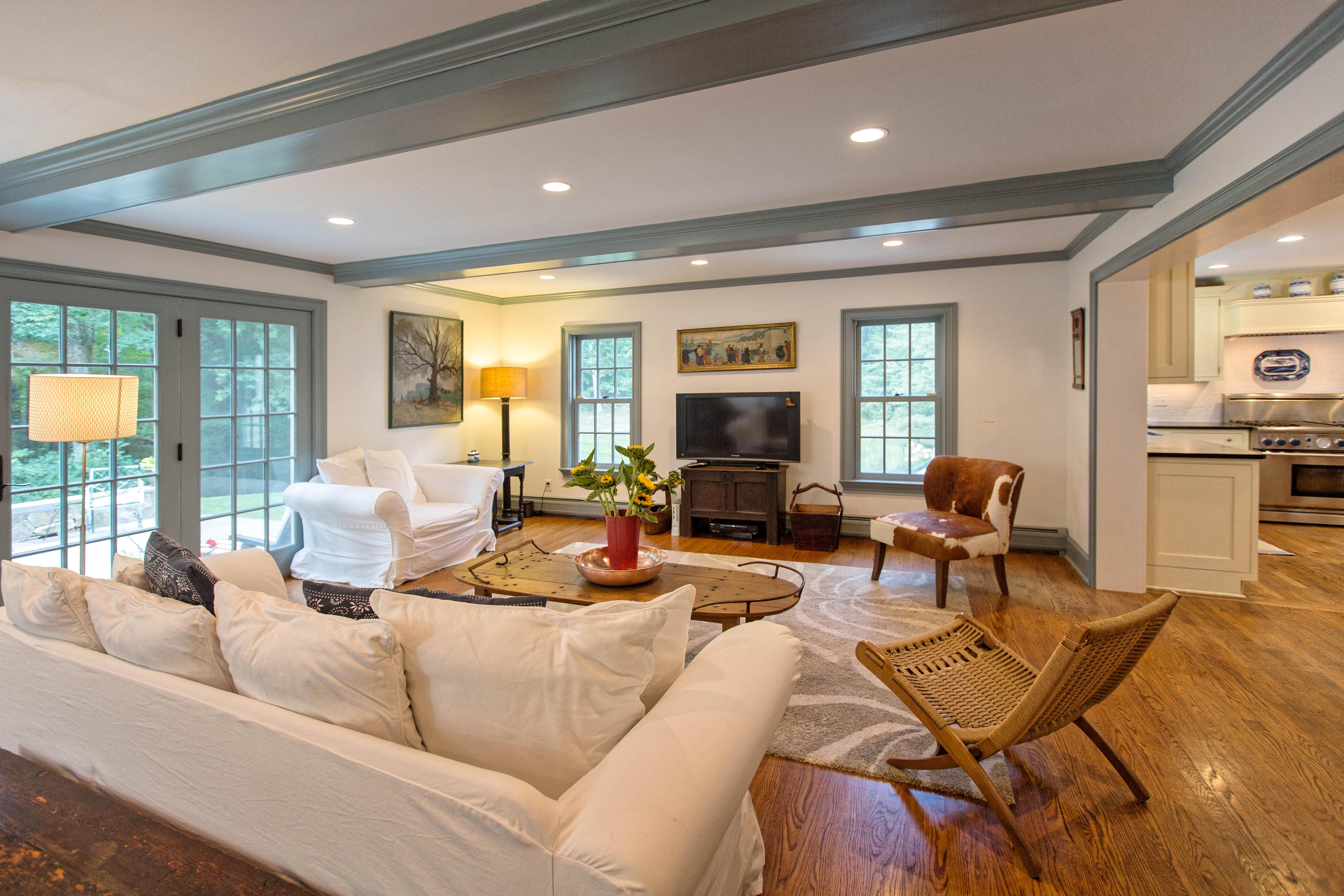 292 Briscoe Road New Canaan, CT 06840 - Photo 17 of 45 a living room with furniture and a table