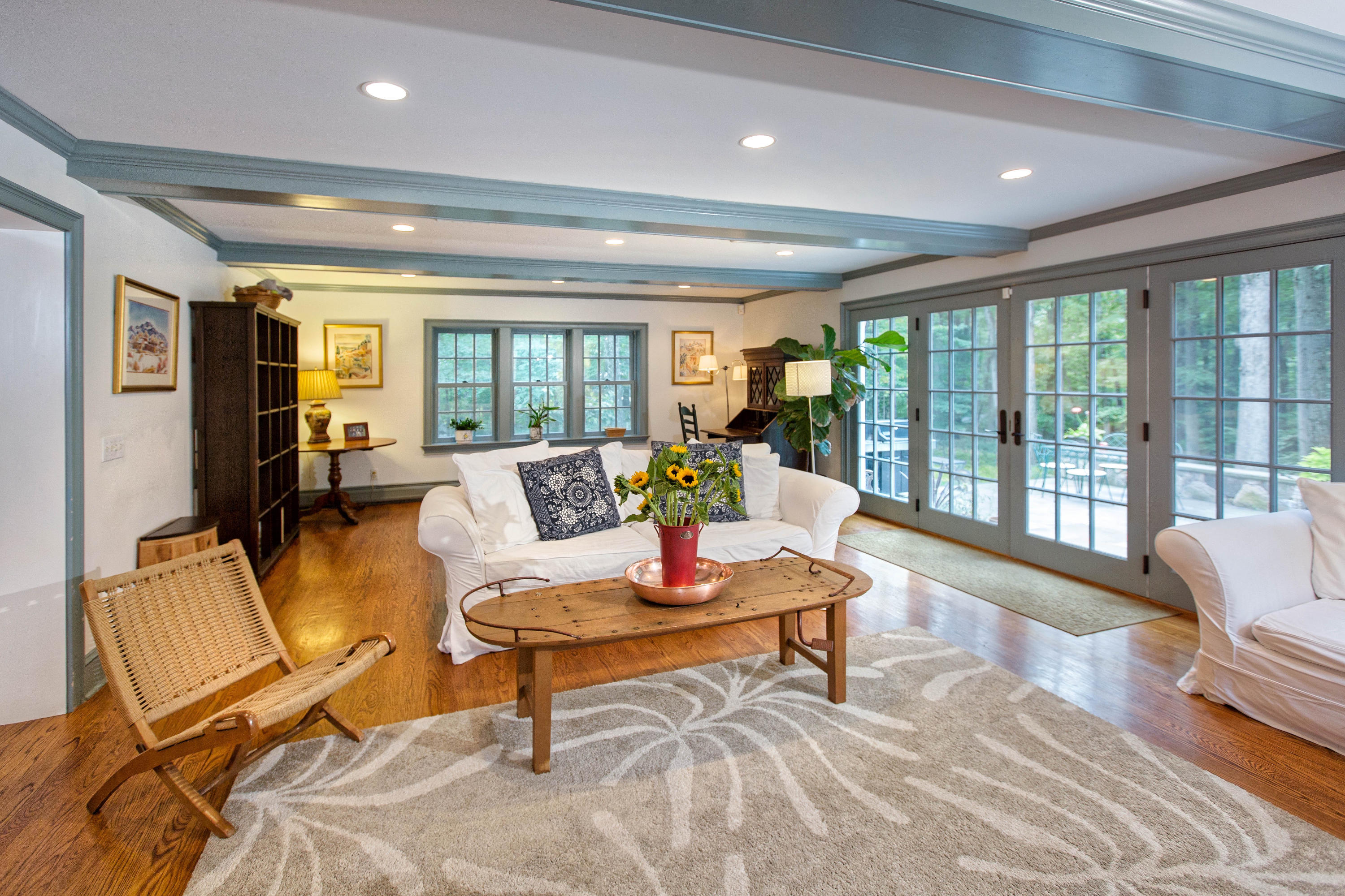 292 Briscoe Road New Canaan, CT 06840 - Photo 18 of 45 a living room with furniture and a floor to ceiling window