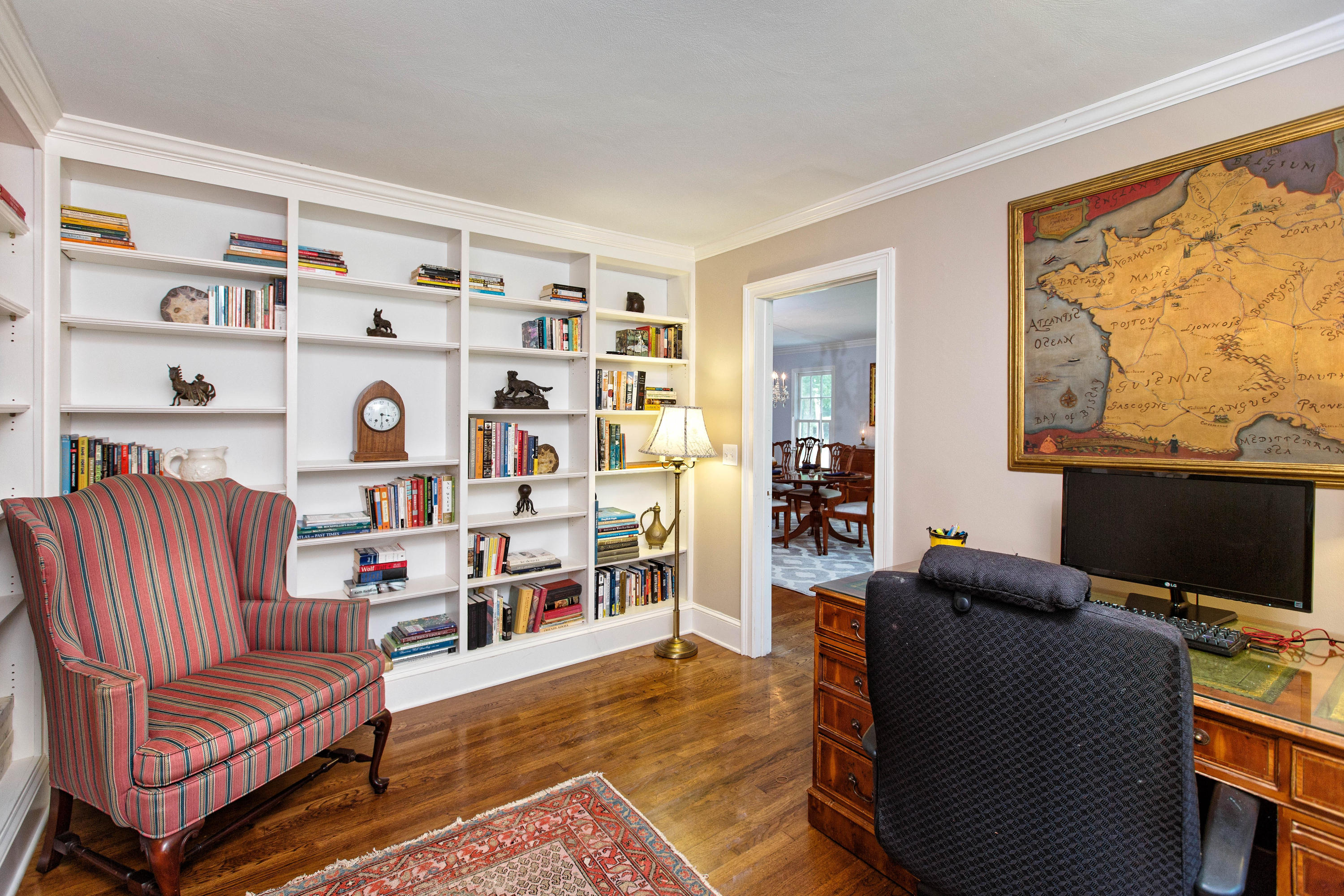 292 Briscoe Road New Canaan, CT 06840 - Photo 24 of 45 a living room with furniture a flat screen tv and a window