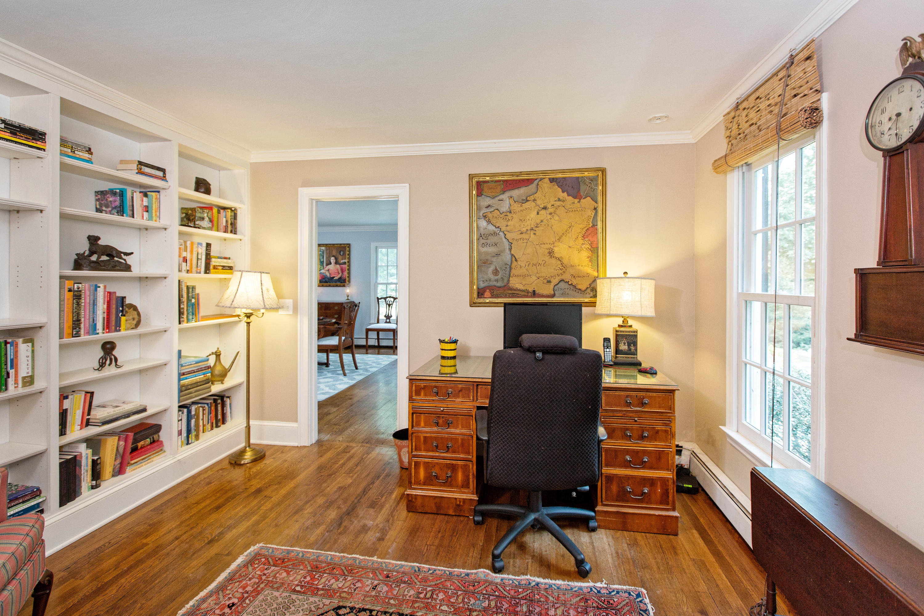 292 Briscoe Road New Canaan, CT 06840 - Photo 25 of 45 a workspace with furniture bookshelf and a window