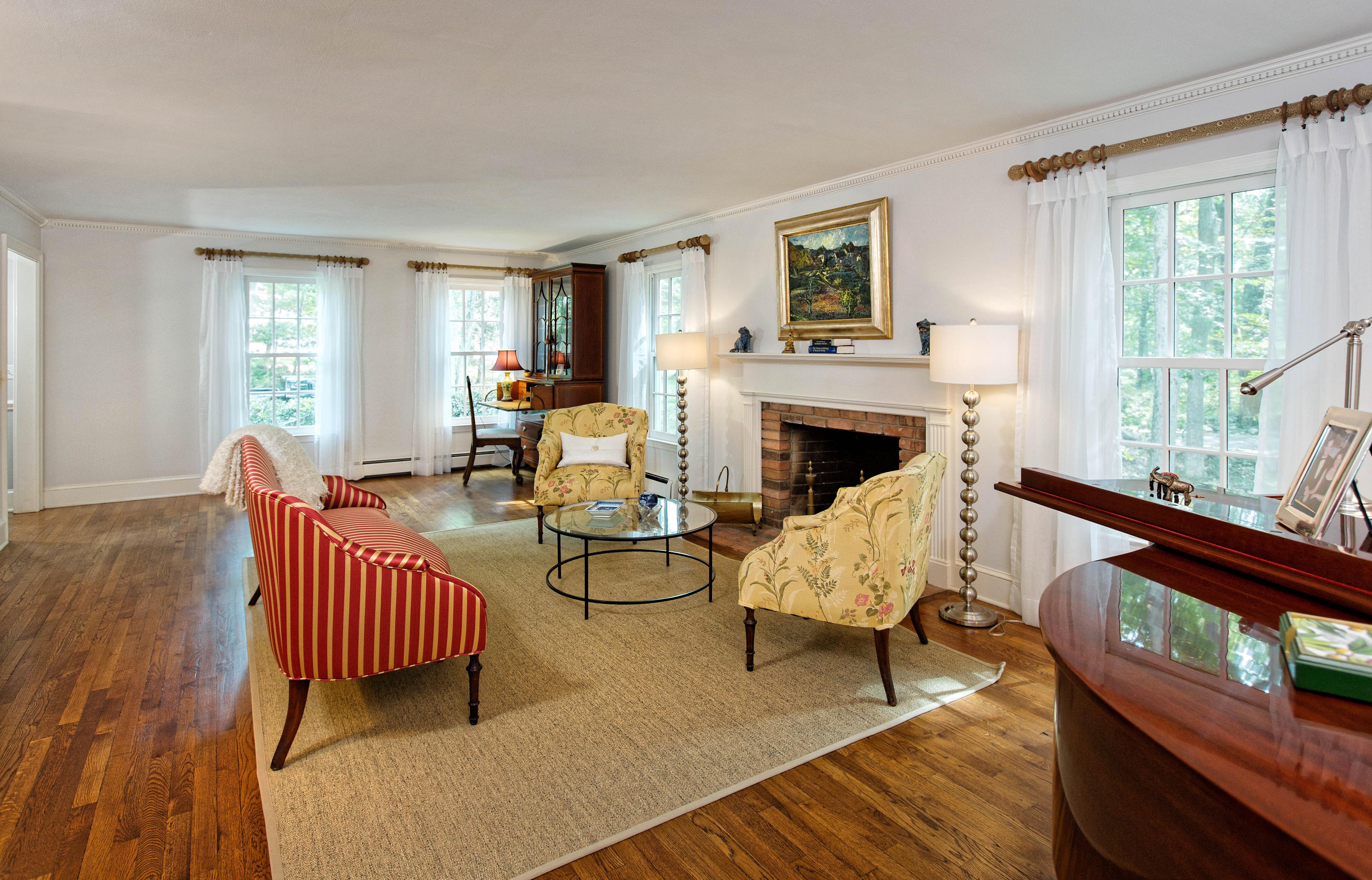 292 Briscoe Road New Canaan, CT 06840 - Photo 26 of 45 a living room with furniture and a fireplace