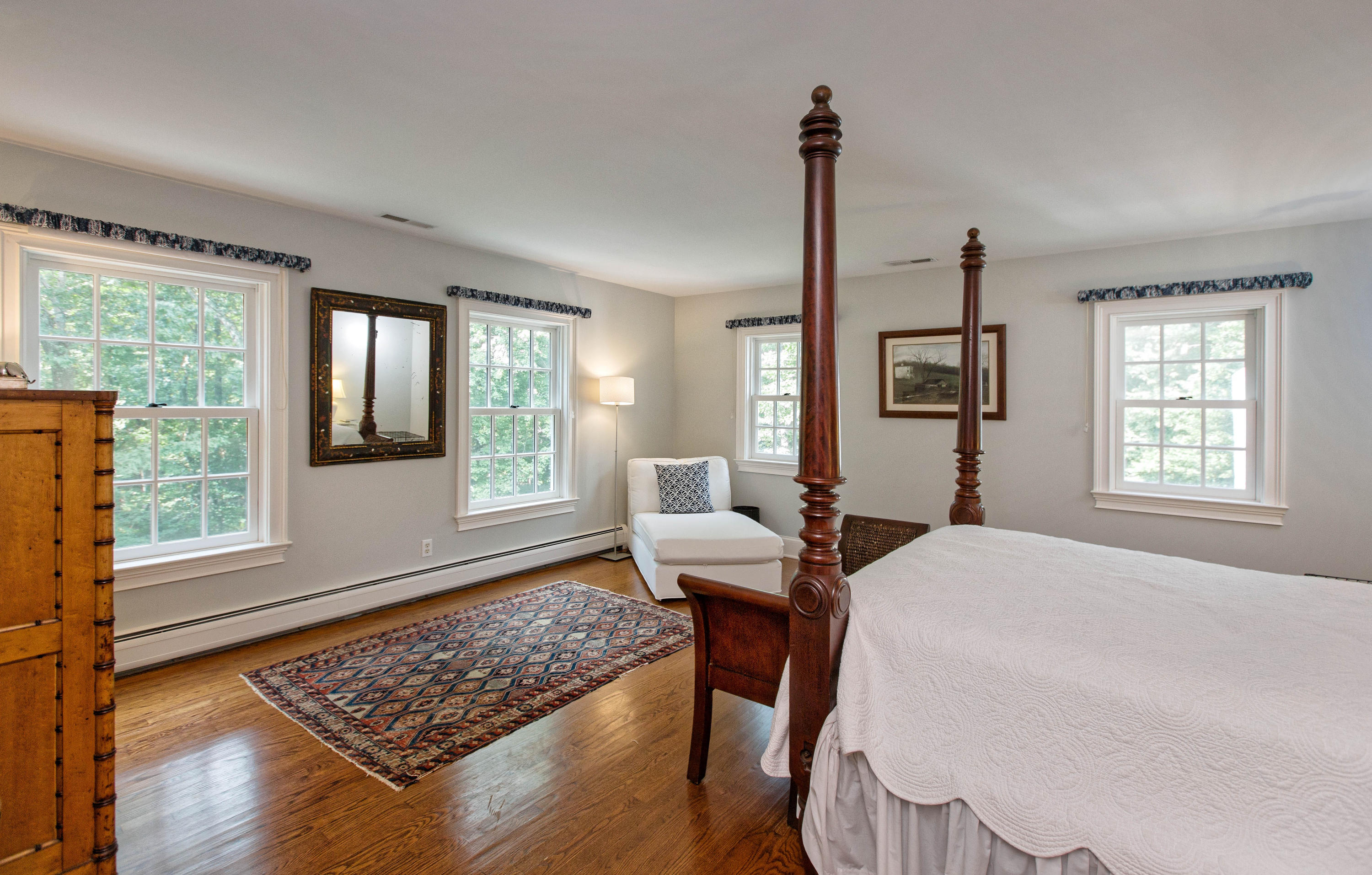 292 Briscoe Road New Canaan, CT 06840 - Photo 29 of 45 a bed room with a bed and windows