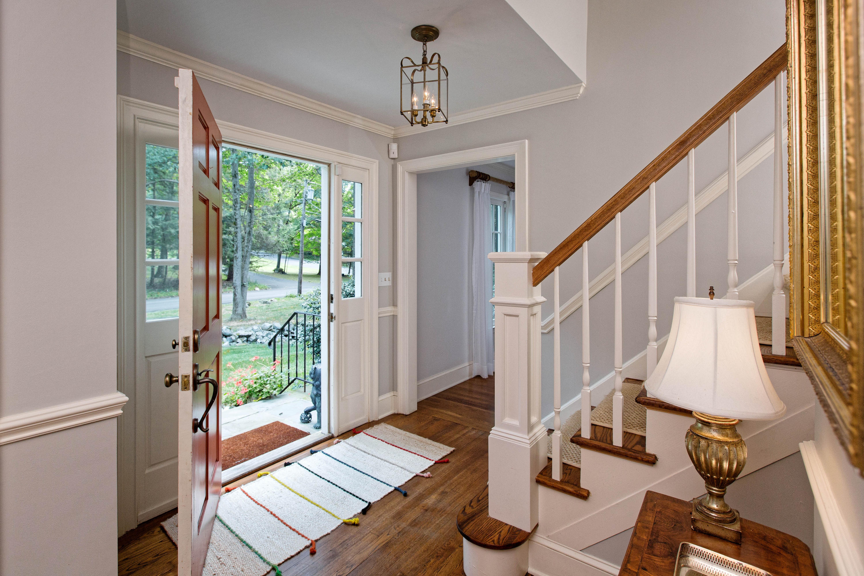 292 Briscoe Road New Canaan, CT 06840 - Photo 4 of 45 a view of an entryway with wooden floor and windows