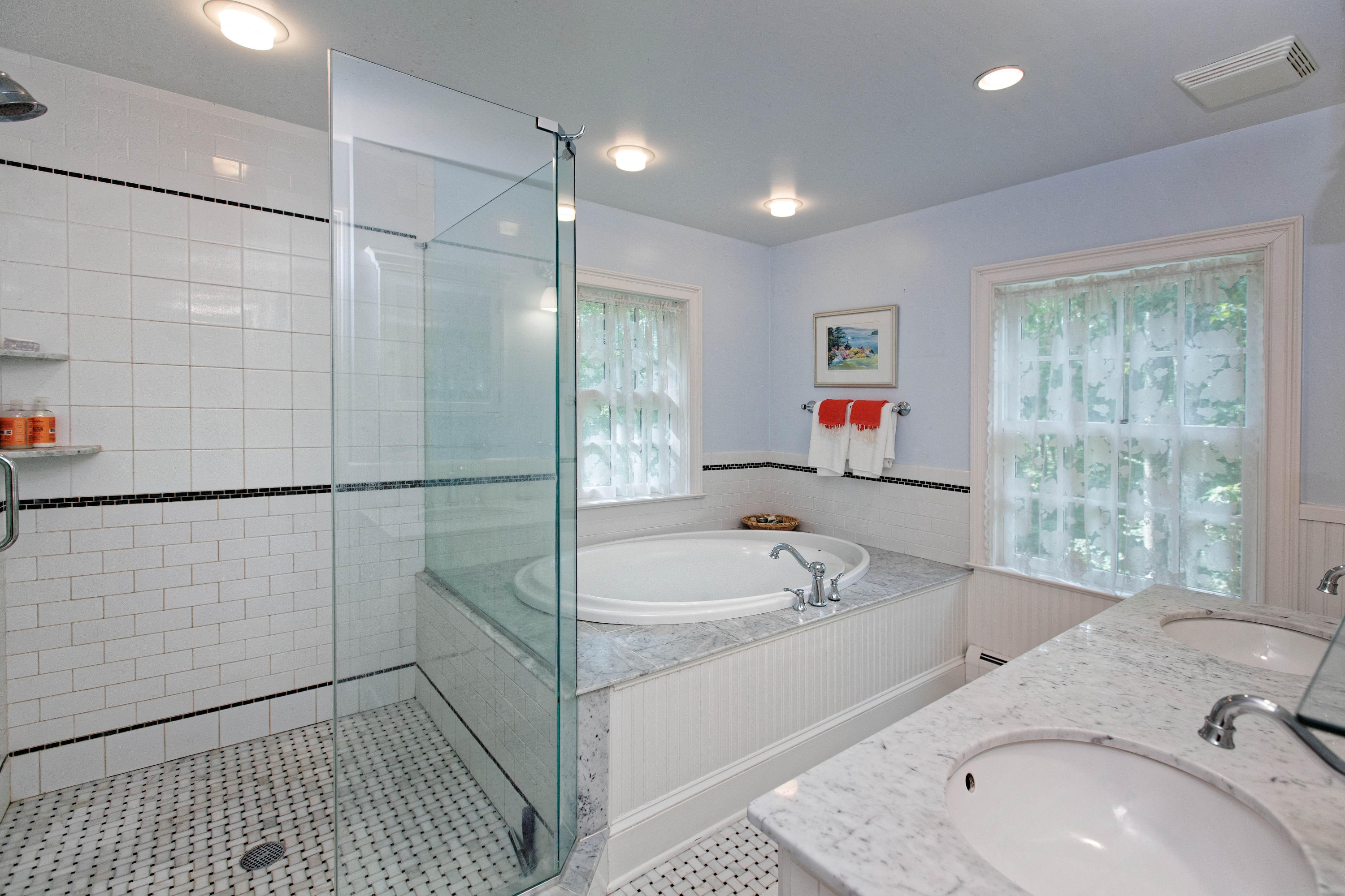 292 Briscoe Road New Canaan, CT 06840 - Photo 34 of 45 a bathroom with a sink and a bathtub