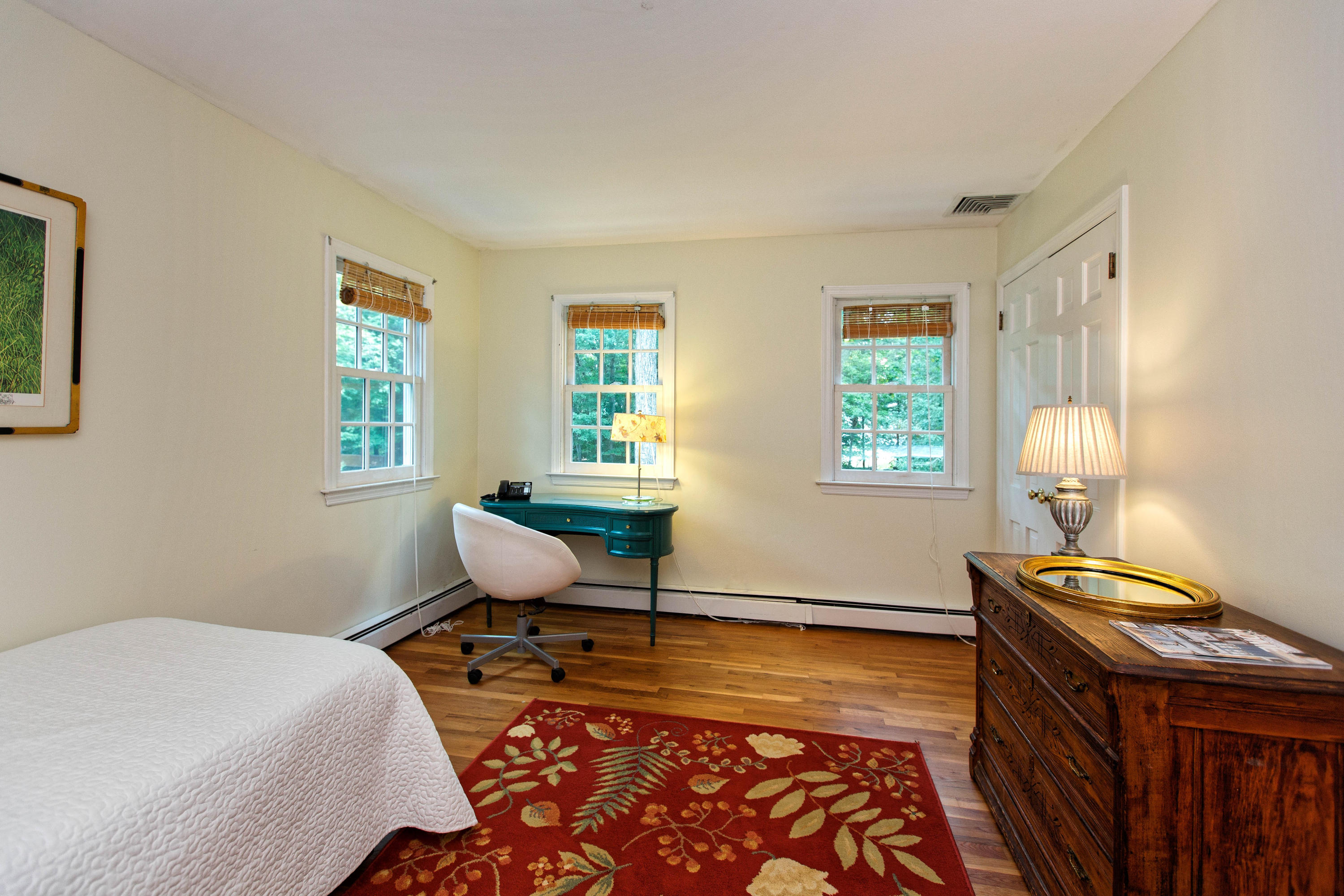 292 Briscoe Road New Canaan, CT 06840 - Photo 36 of 45 a bedroom with a bed and wooden floor