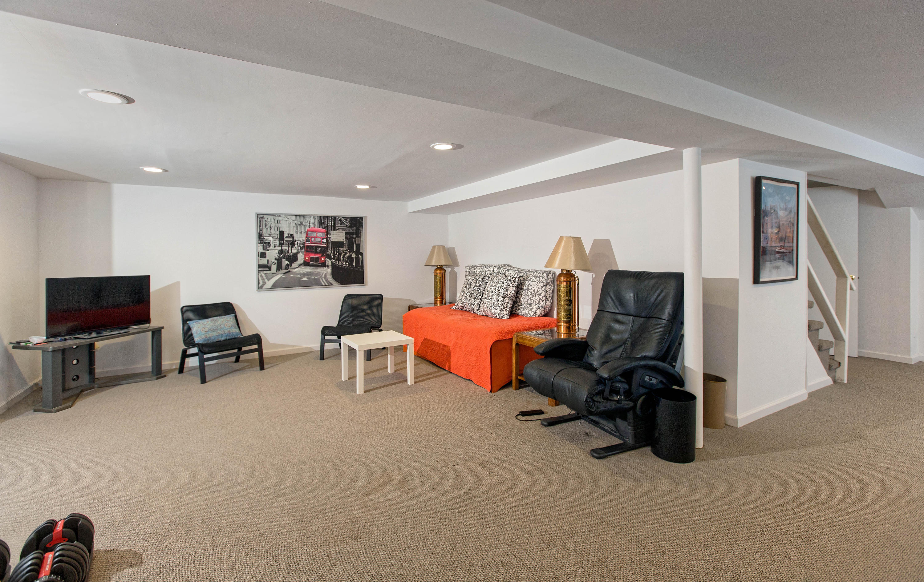 292 Briscoe Road New Canaan, CT 06840 - Photo 43 of 45 a bed room with furniture and a flat screen tv