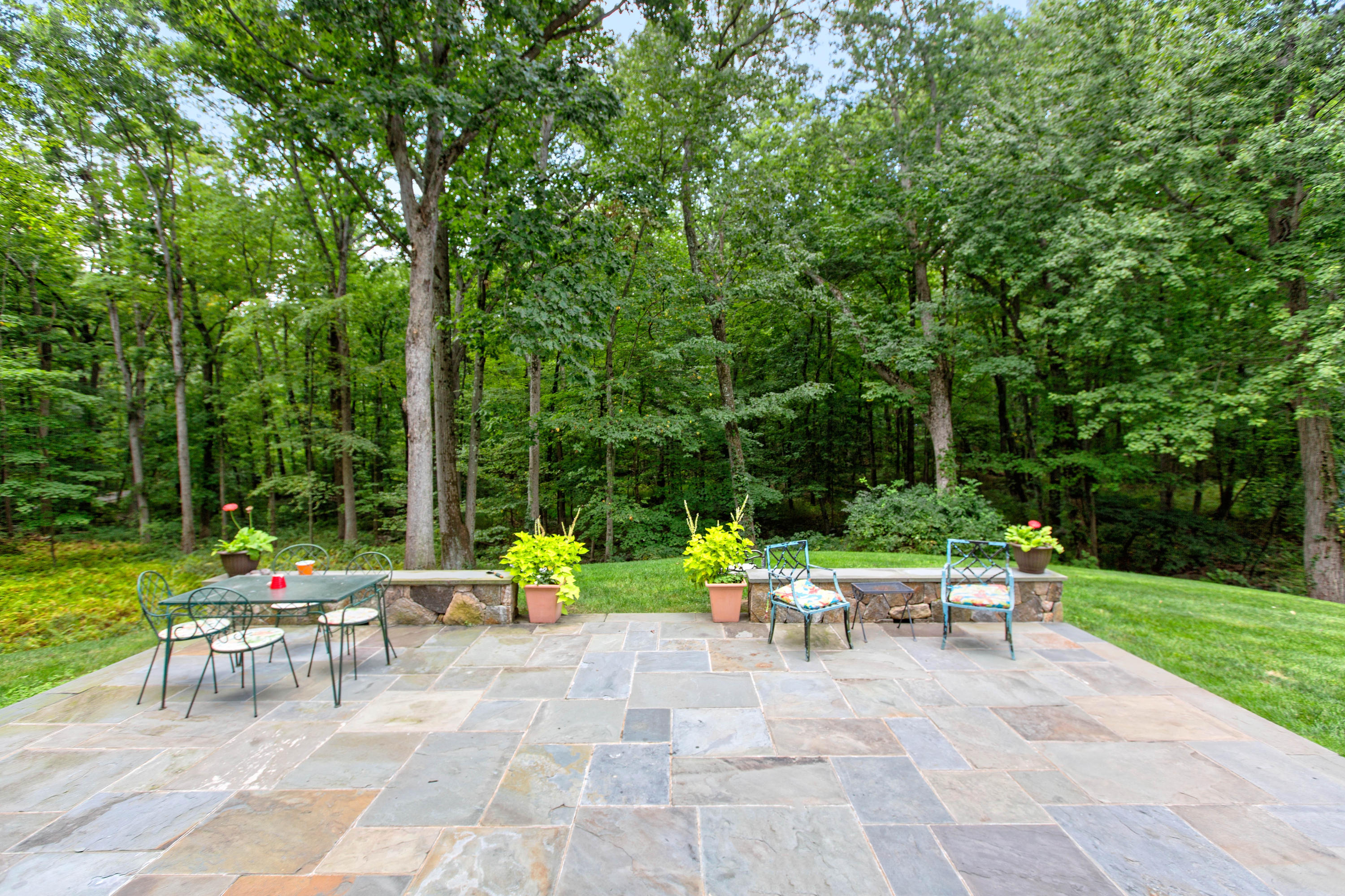 292 Briscoe Road New Canaan, CT 06840 - Photo 44 of 45 a view of backyard with sitting area and garden