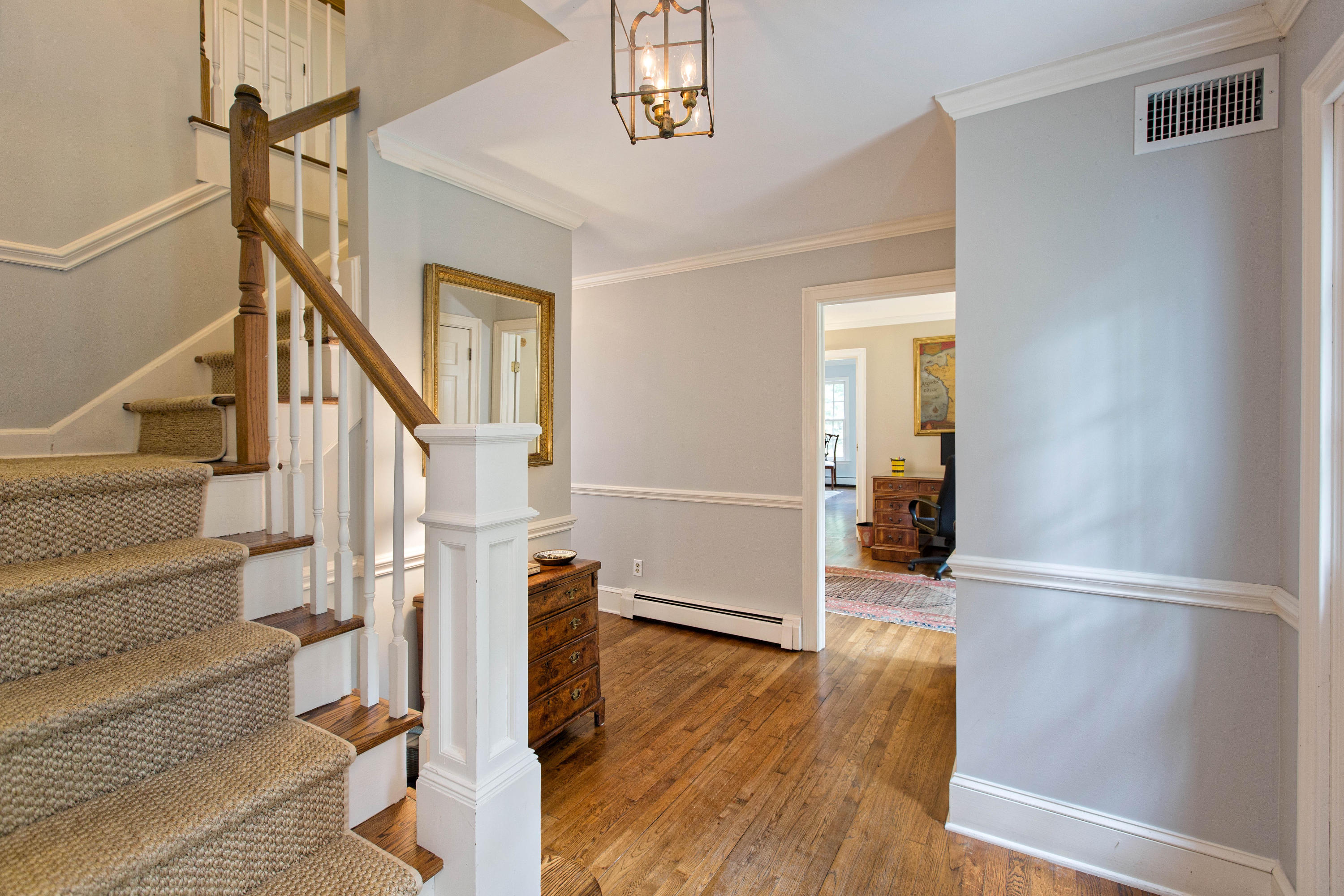292 Briscoe Road New Canaan, CT 06840 - Photo 6 of 45 a view of entryway with wooden floor and stairs