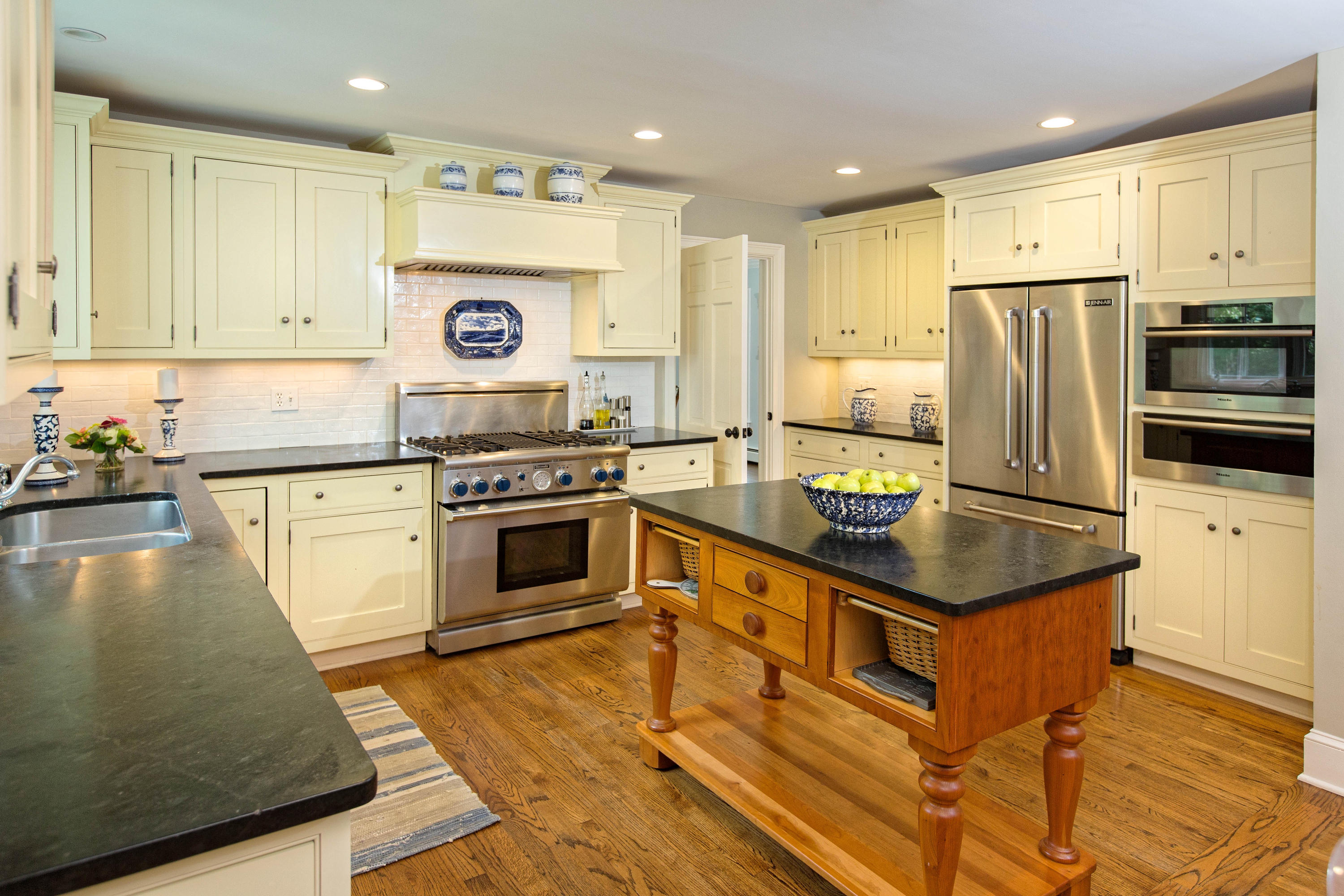 292 Briscoe Road New Canaan, CT 06840 - Photo 10 of 45 a kitchen with stainless steel appliances granite countertop a stove a sink and a refrigerator